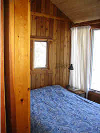 The master bedroom overlooks the lake - Queen Size Bed